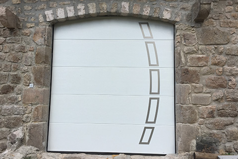 pose de porte de garage sectionnelle